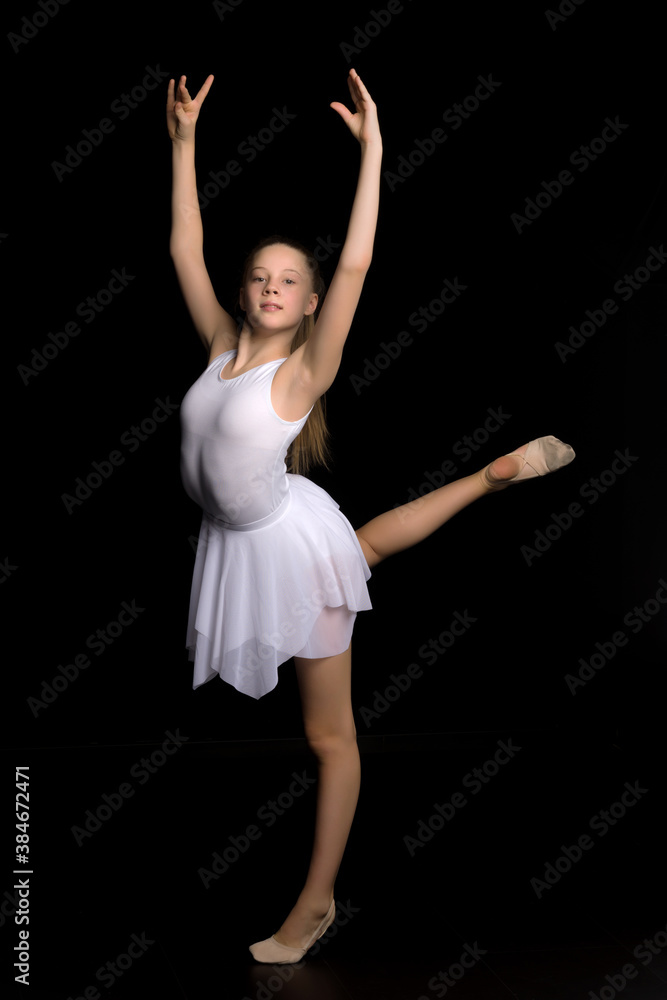 Full length portrait of a charming gymnast girl in elegant dress.