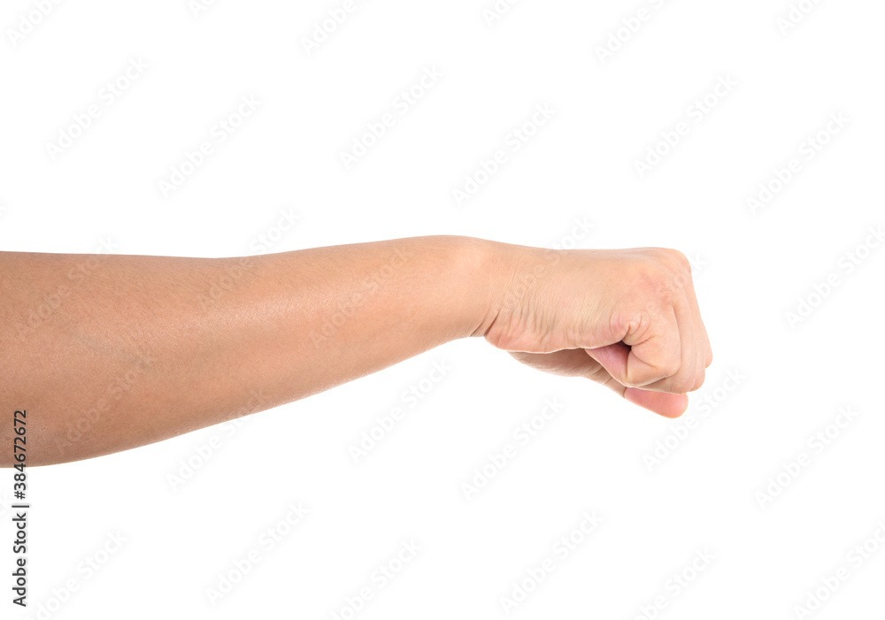 Clenched fist strikes out in front of white background Clenched fist strikes out in front of white background
