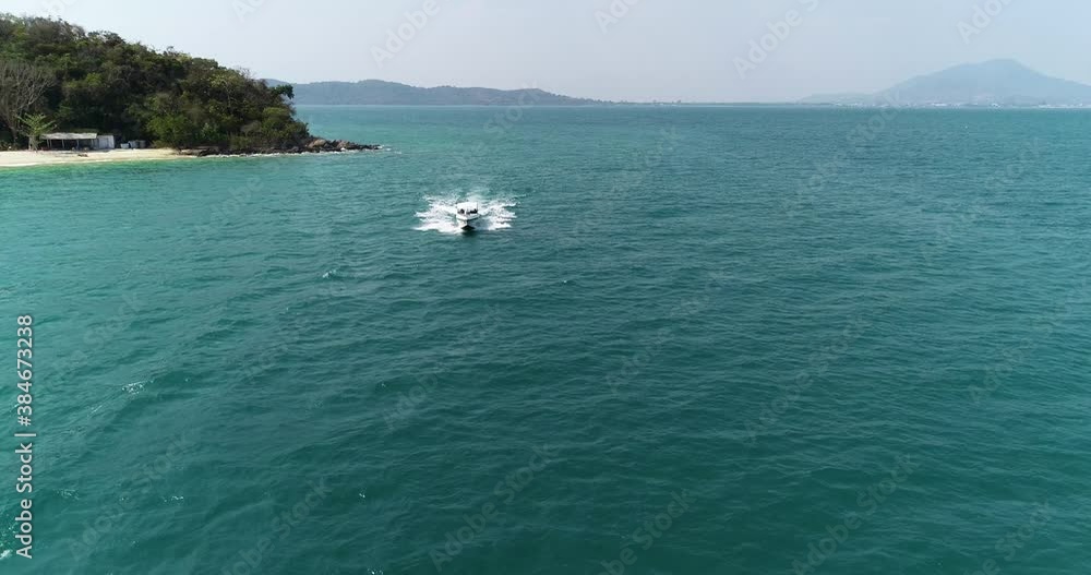 Speedboat Traveling by Ocean in Southeast Asia in Thailand - Aerial Drone Speedboat Traveling by Ocean in Southeast Asia in Thailand - Aerial Drone
