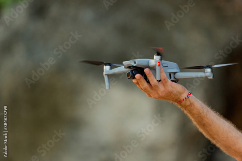 drone takes off from hand. natural background