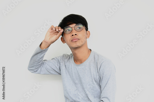Portrait of Asian man wearing glasses thinking of ideas