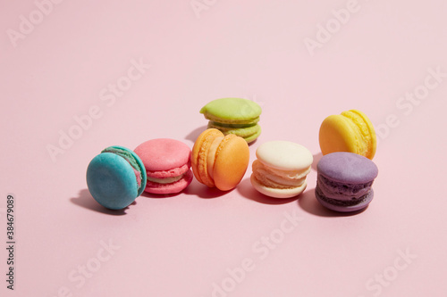 colourful macaroon on pastel pink background
