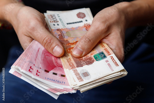 Chinese yuan and Russian rubles in hand