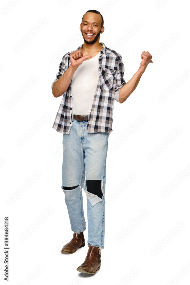 Joyful friendly african-american young man iwearing casual shirt pointing by finger at copy space Joyful friendly african-american young man iwearing casual shirt pointing by finger at copy space