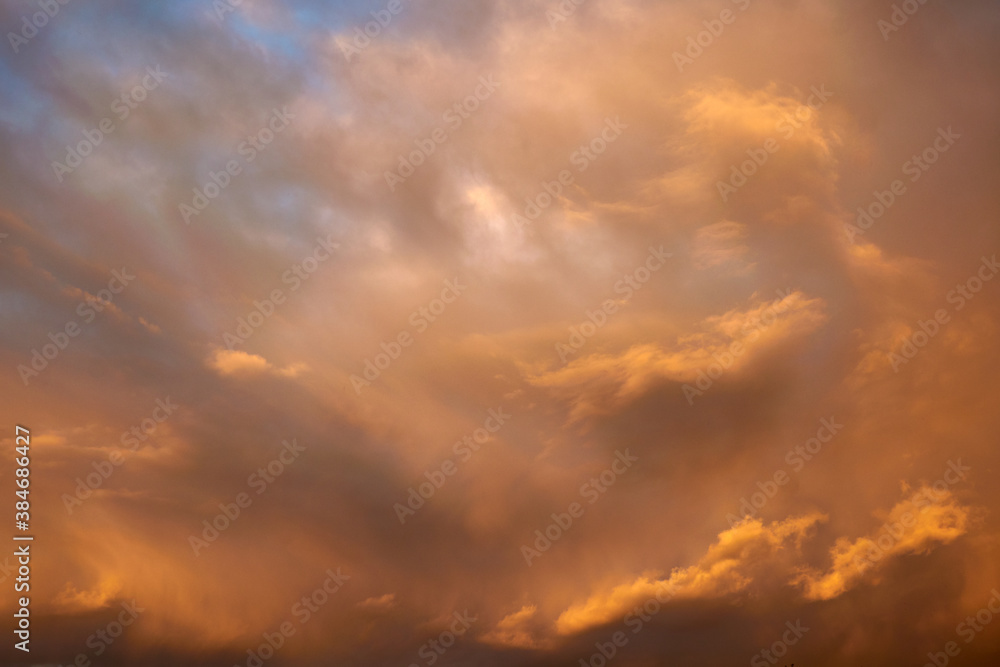 Sky at sunset and red fluffy clouds, skies background. 