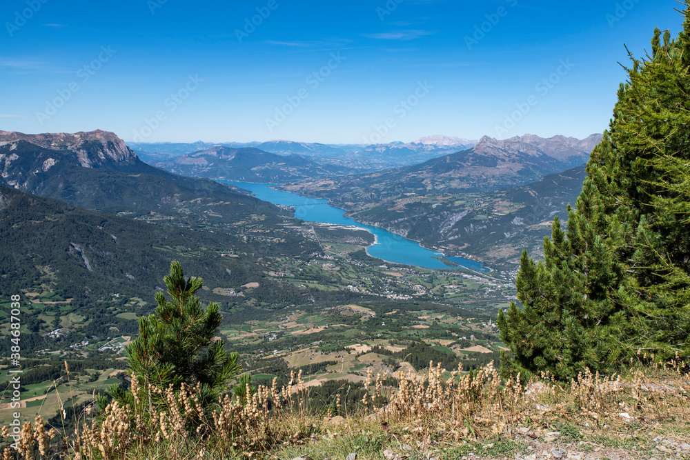 Mountain landscape with a lake in the distance
Mountain landscape with a lake in the distance