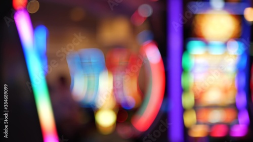 Photography Defocused slot machines glow in casino on fabulous Las Vegas Strip, USA