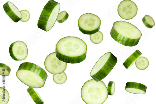 Obraz na płótnie Falling cucumber slices isolated on a white background with clipping path
