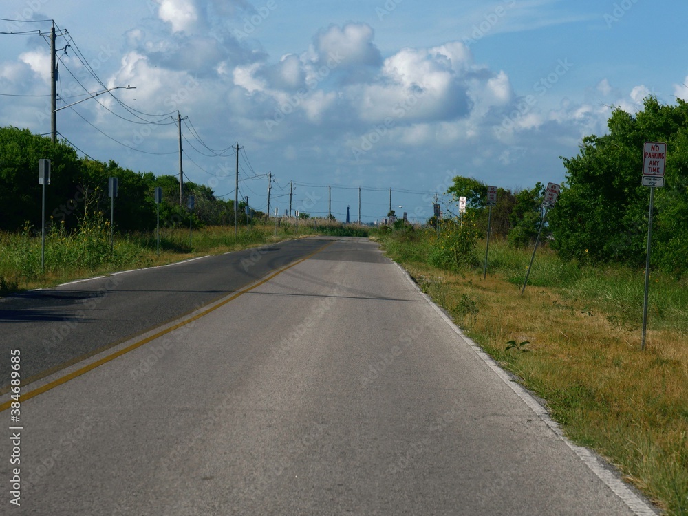 custom made wallpaper toronto digitalOne of the roads in Galveston, Texas, with thick clouds in the skies.