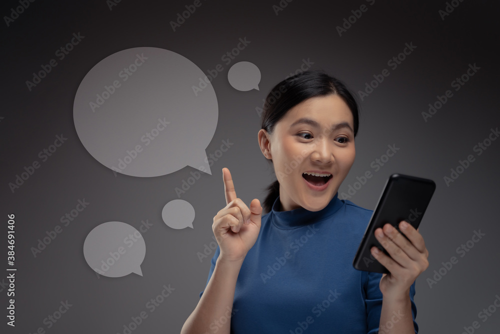 Woman using smart phone and icon hologram effect. Woman using smart phone and icon hologram effect.