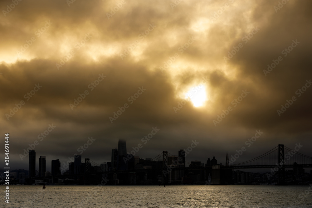 Dramatic Sunset over San Francisco Downtown via Port View Park in Oakland California