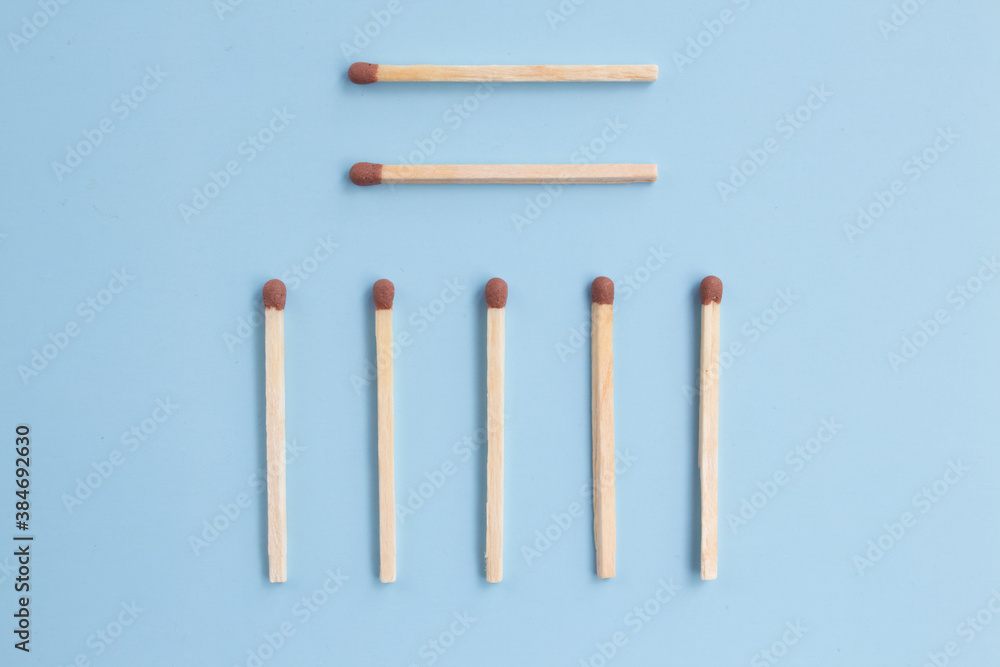 Conceptual figures from matches on a bright background. Downtime and minimal art object. Not like everyone else, different from the crowd Conceptual figures from matches on a bright background. Downtime and minimal art object. Not like everyone else, different from the crowd