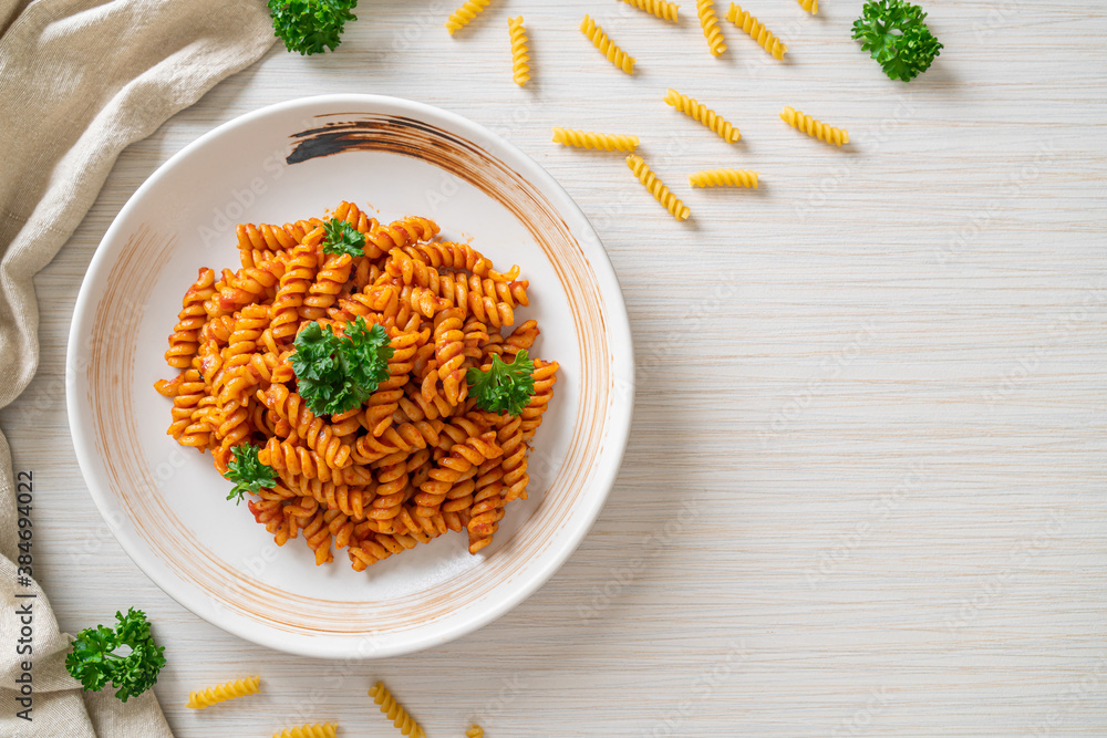 alarm opening Gedateerd Stockfoto spirali or spiral pasta with tomato sauce | Adobe Stock