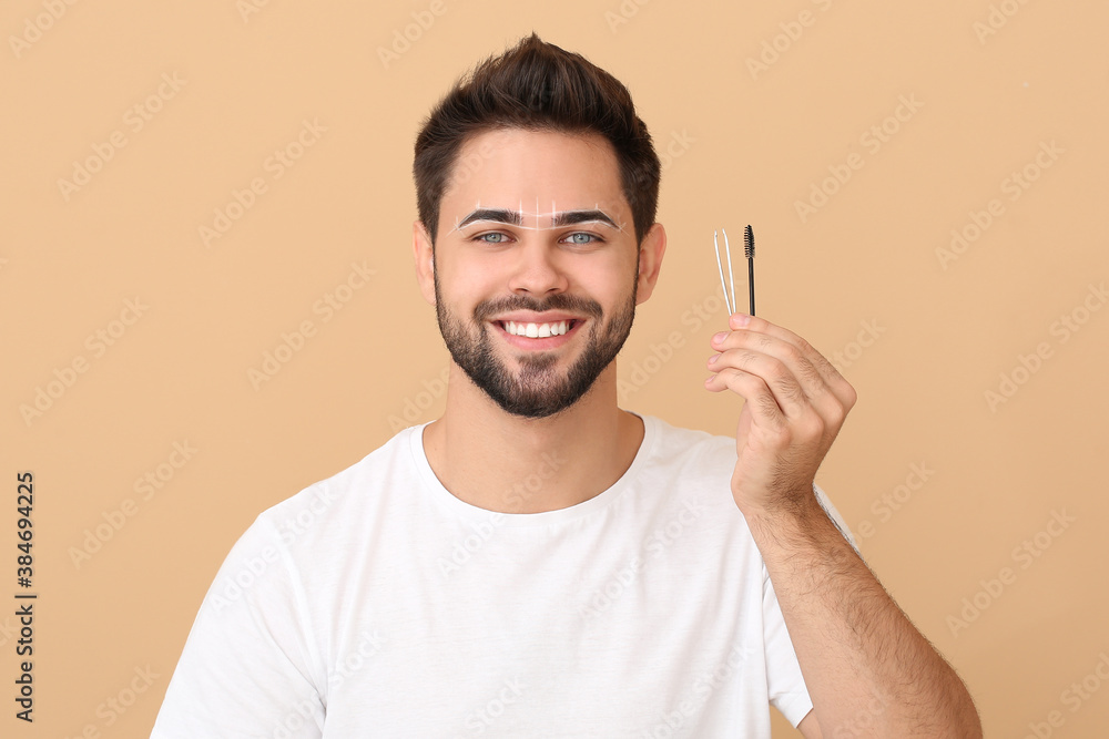 Young man with tools for eyebrow correction procedure on color background