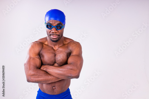 afro latin mixed race man swimmer getting ready to start swimming isolated on white background in studio