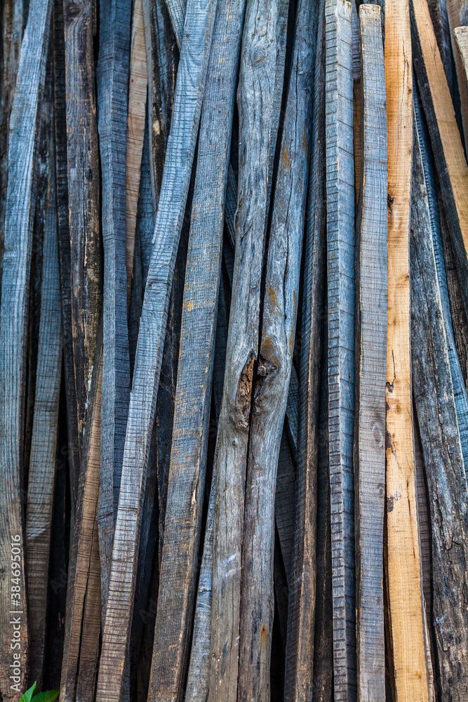 Fototapeta premium Wooden sticks for fence construction