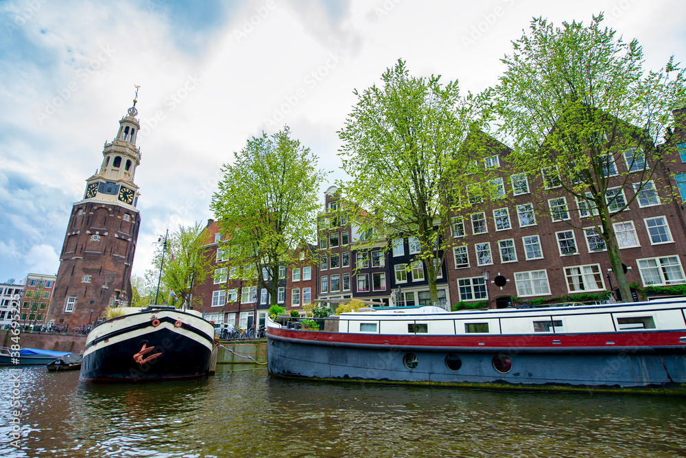 Amsterdam canals and boats with buildings, The Netherlands