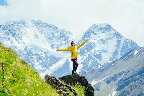 happy free woman in summer on Elbrus