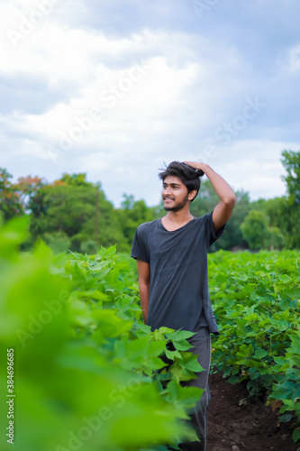 Young indian college student in cotton field
