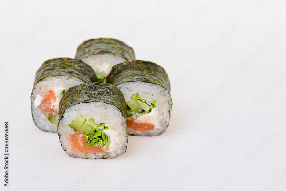 Four sushi fresh maki rolls, isolated on white. Set of maki rolls with philadelphia cheese. Japanese cuisine. Four sushi fresh maki rolls, isolated on white. Set of maki rolls with philadelphia cheese. Japanese cuisine.