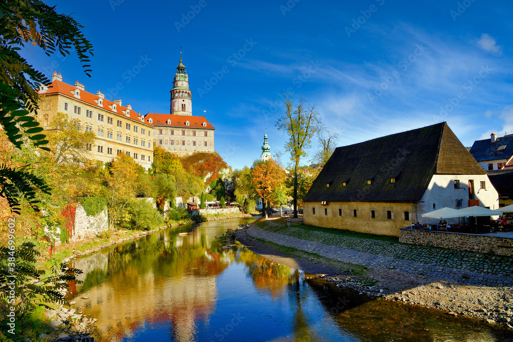 Water reflection of State Castle and Chateau Cesky Krumlov, Czech Republic in the Old Town, afternoon with blue sky and beautiful clouds. Water reflection of State Castle and Chateau Cesky Krumlov, Czech Republic in the Old Town, afternoon with blue sky and beautiful clouds.