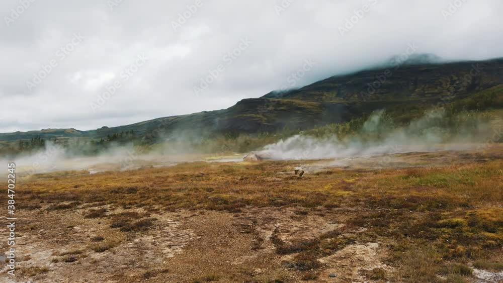 Hot mud pool, Iceland, hot water bubbling up from ground Hot mud pool, Iceland, hot water bubbling up from ground