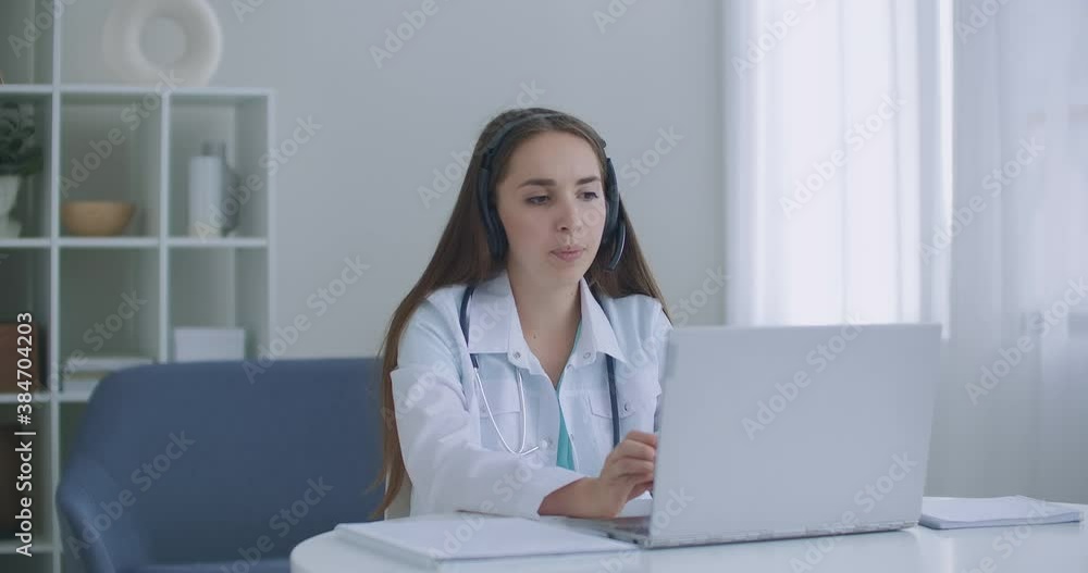 doctor wear headset consult female patient make online webcam video call on laptop screen. Telemedicine videoconference remote computer app virtual meeting. doctor wear headset consult female patient make online webcam video call on laptop screen. Telemedicine videoconference remote computer app virtual meeting.