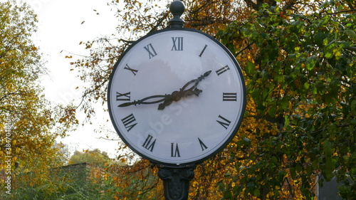 Classic clock in autumn park
