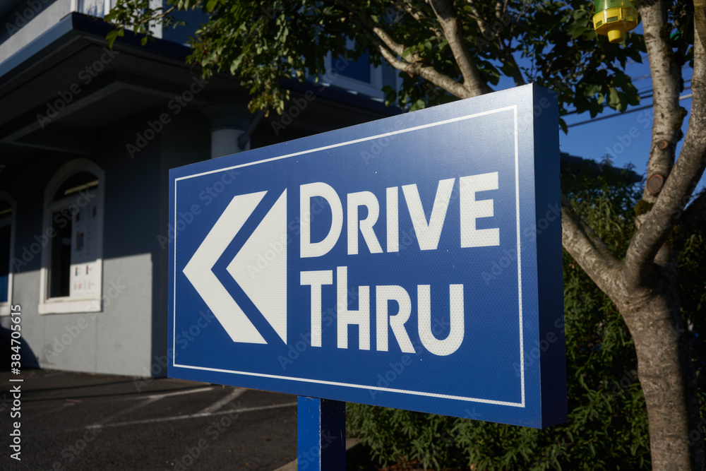 The drive thru sign outside a drive-through fast food restaurant. The drive thru sign outside a drive-through fast food restaurant.