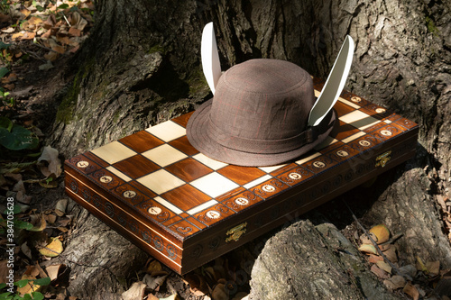  A hat with rabbit ears on the chessboard.