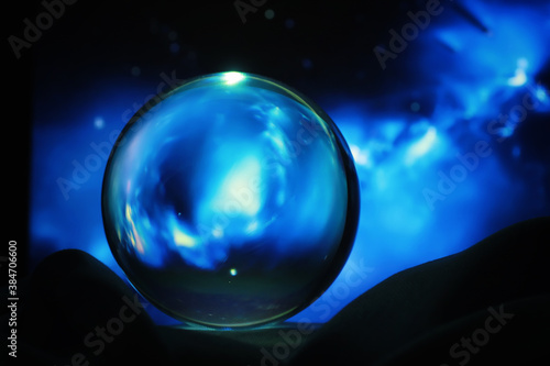 Astrological background. Crystal ball with predictions. Horoscope of the stars. Fortune telling and determination of fate. Soothsayer with a crystal ball.