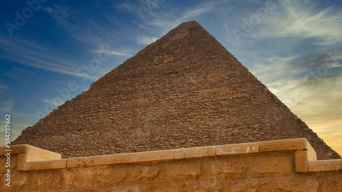 Pyramid behind an old stone wall