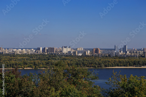 Panorama of a big city with a lake