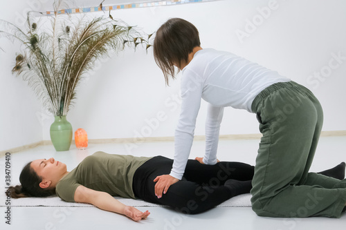 Teenager getting Shiatsu massage from Shiatsu masseuse