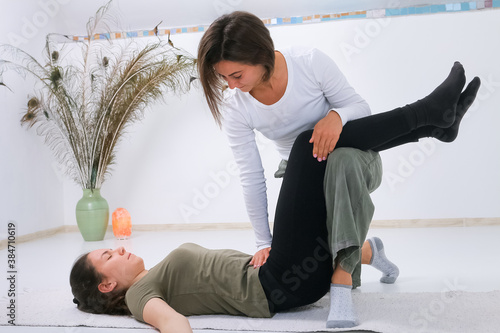 Teenager getting Shiatsu massage from Shiatsu masseuse