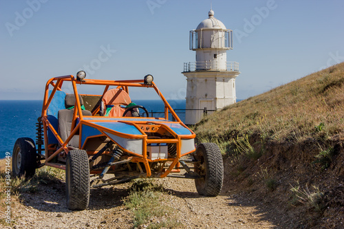 Homemade buggy on the road near the lighthouse in the mountains