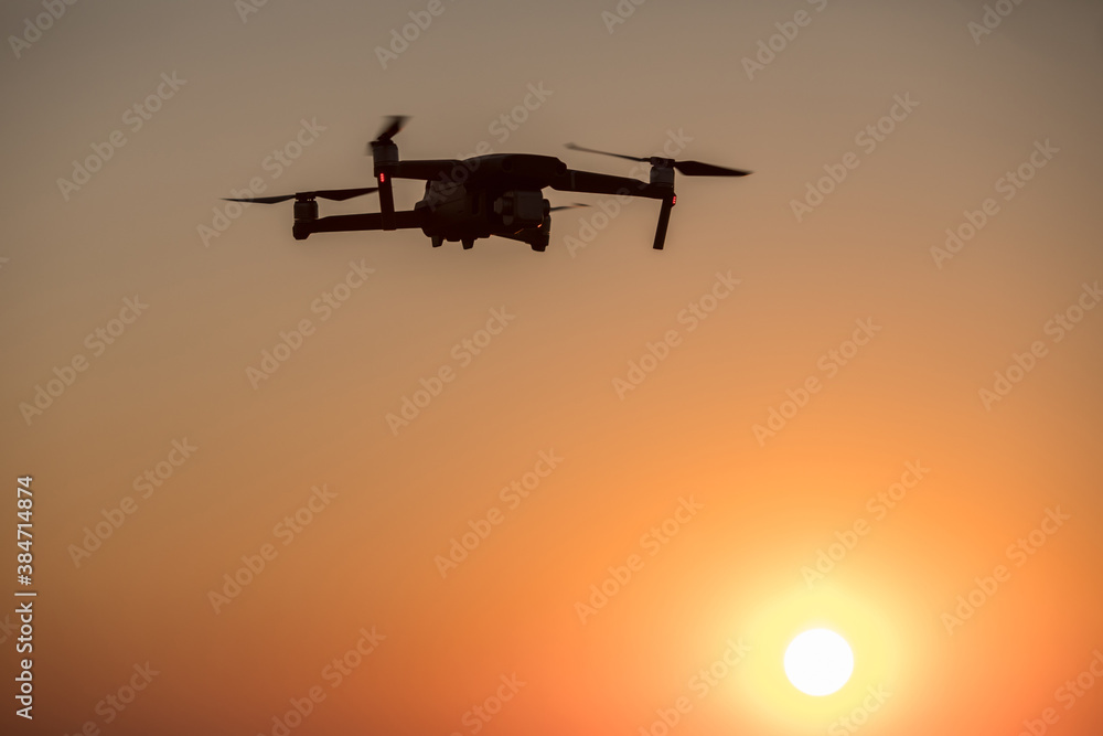 Drone flying at sunrise