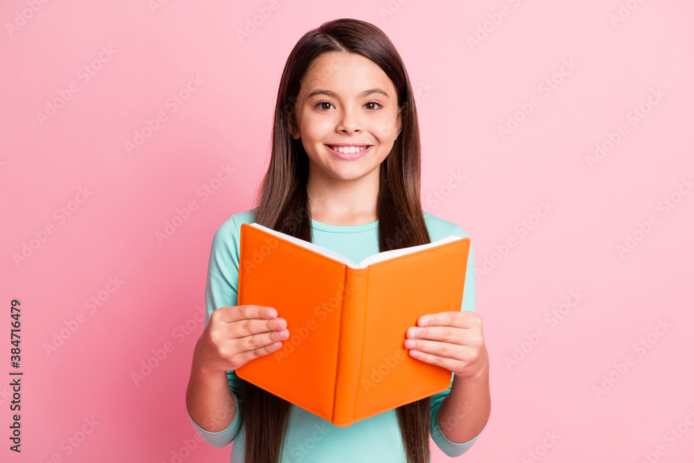 Close-up portrait of her she nice attractive pretty charming confident cheerful cheery long-haired girl reading academic book subject isolated over pink pastel color background Close-up portrait of her she nice attractive pretty charming confident cheerful cheery long-haired girl reading academic book subject isolated over pink pastel color background