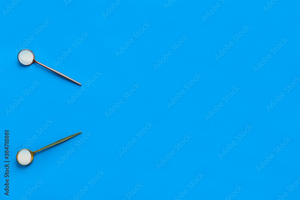 Marine collagen powder in spoons on a blue background. Dietary supplement. Horizontal orientation, top view, copy space. Marine collagen powder in spoons on a blue background. Dietary supplement. Horizontal orientation, top view, copy space.