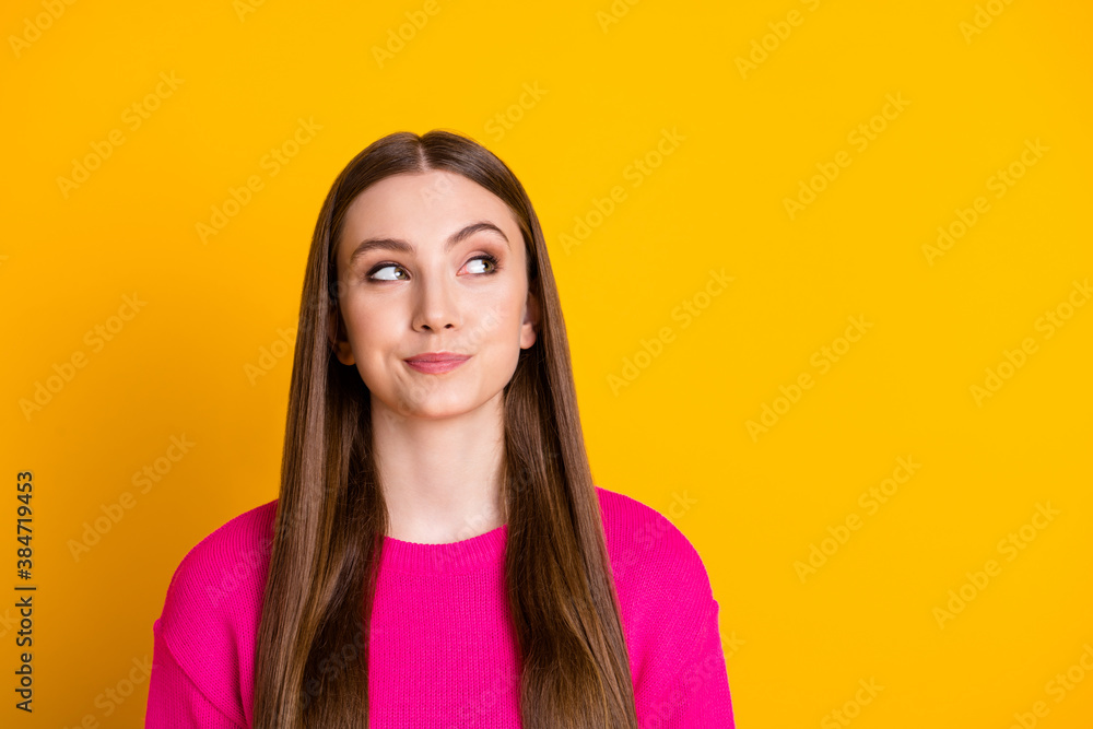 Photo of lovely girl suspicious look up empty space wear pink pullover isolated yellow color background Photo of lovely girl suspicious look up empty space wear pink pullover isolated yellow color background