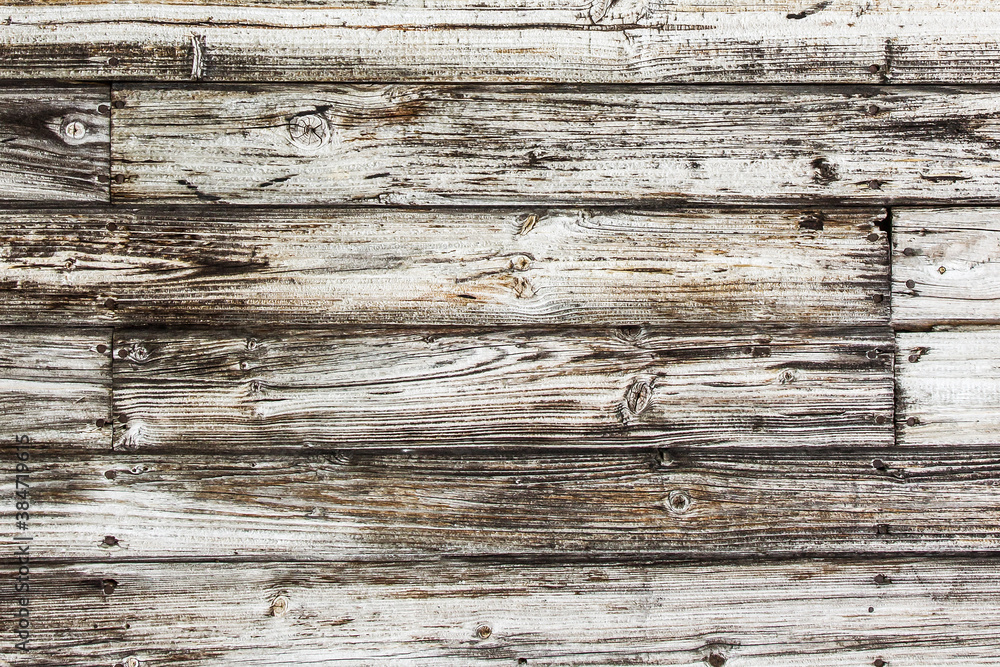 Raw wood texture. Brown wooden wall background. Rustic desks with knots pattern. Countryside architecture wall. Village building construction. Peeling paint board. Raw wood texture. Brown wooden wall background. Rustic desks with knots pattern. Countryside architecture wall. Village building construction. Peeling paint board.
