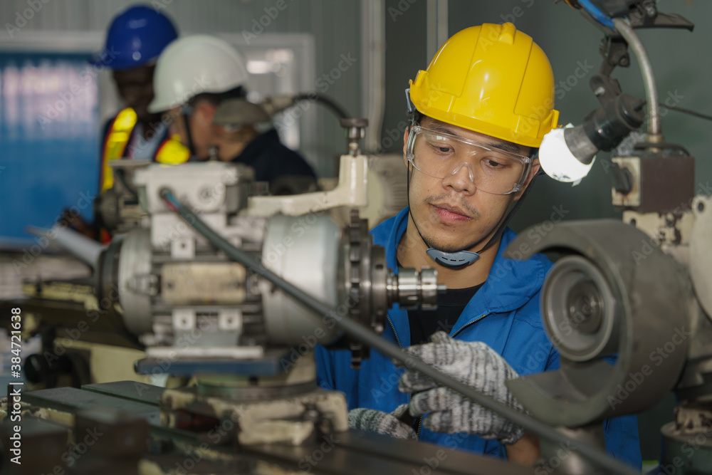 metal work factory worker working with lathe machine in lathe workshop metal work factory worker working with lathe machine in lathe workshop