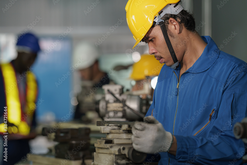 metal work factory worker working with lathe machine in lathe workshop metal work factory worker working with lathe machine in lathe workshop
