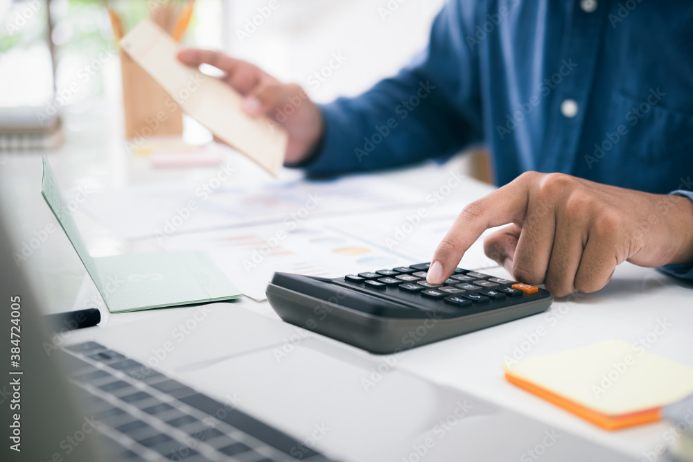 Accountant or banker calculate the cash bill. Accountant or banker calculate the cash bill.