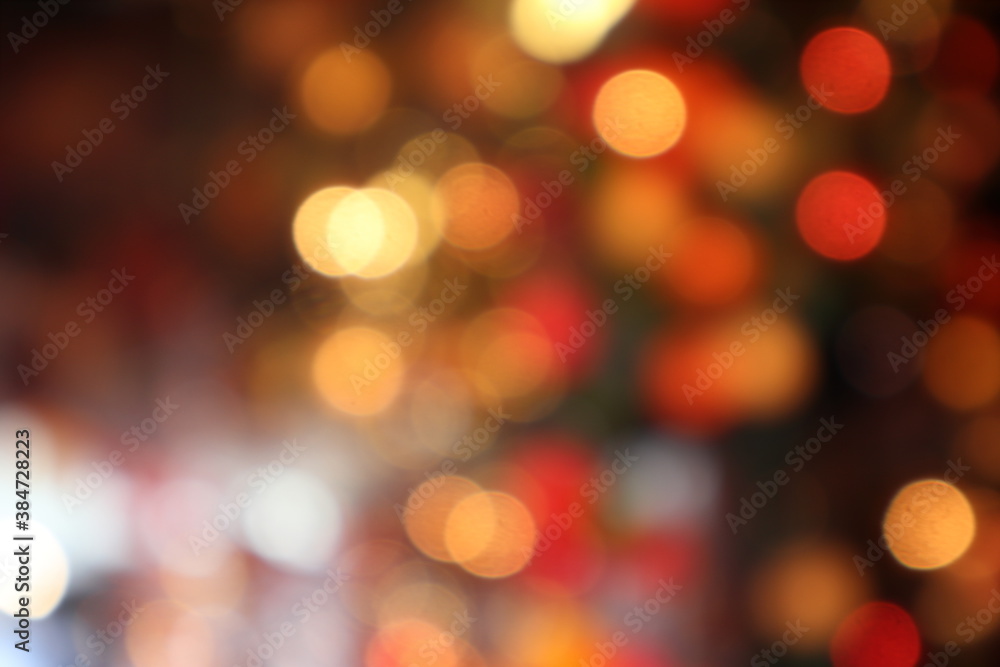 black abstract background of defocused bokeh colorful blurred beautiful shiny illuminate or Christmas new year celebration party with happy family