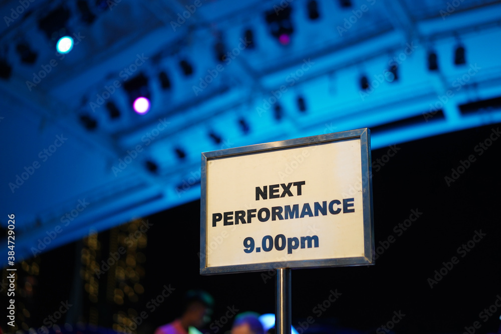 Display stand of notice at a night indoor performance