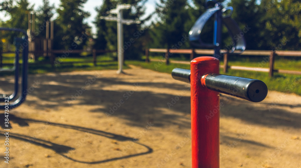 Street gym in empty city park on yellow sand