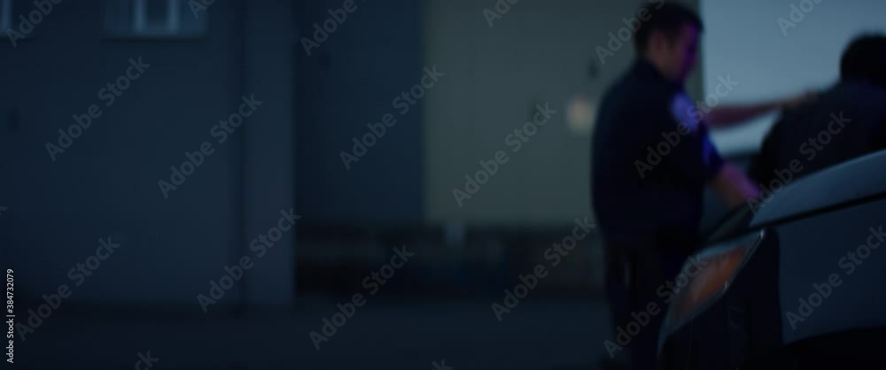 CU on hands, man being handcuffed near unmarked police vehicle in the street. Shot on RED Dragon with 2x Anamorphic lens CU on hands, man being handcuffed near unmarked police vehicle in the street. Shot on RED Dragon with 2x Anamorphic lens