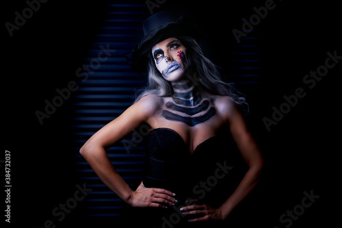 Spooky portrait of woman in halloween gotic makeup