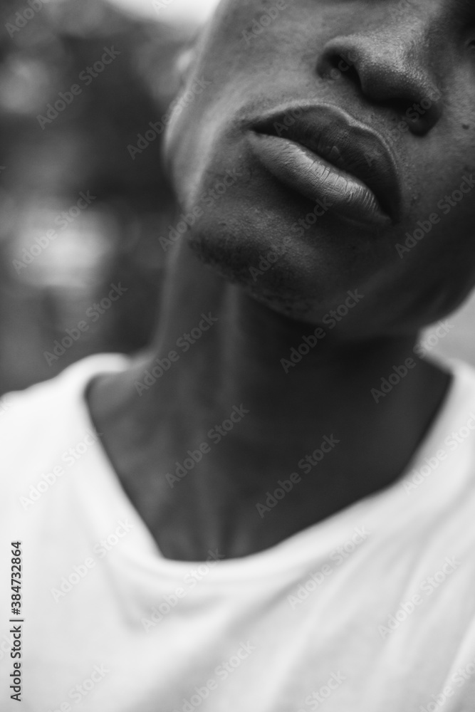 Close up of young man standing on street